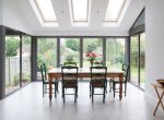 A dining area with Korniche aluminum bifold doors.